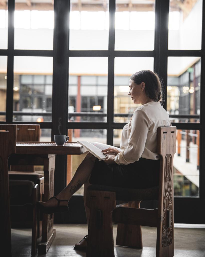 Aleisha Bezuidenhout, founding director of AB Legal Inc., reading at her desk